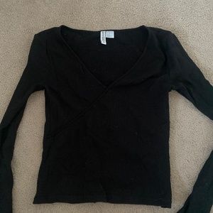 Divided long sleeve crossover black top